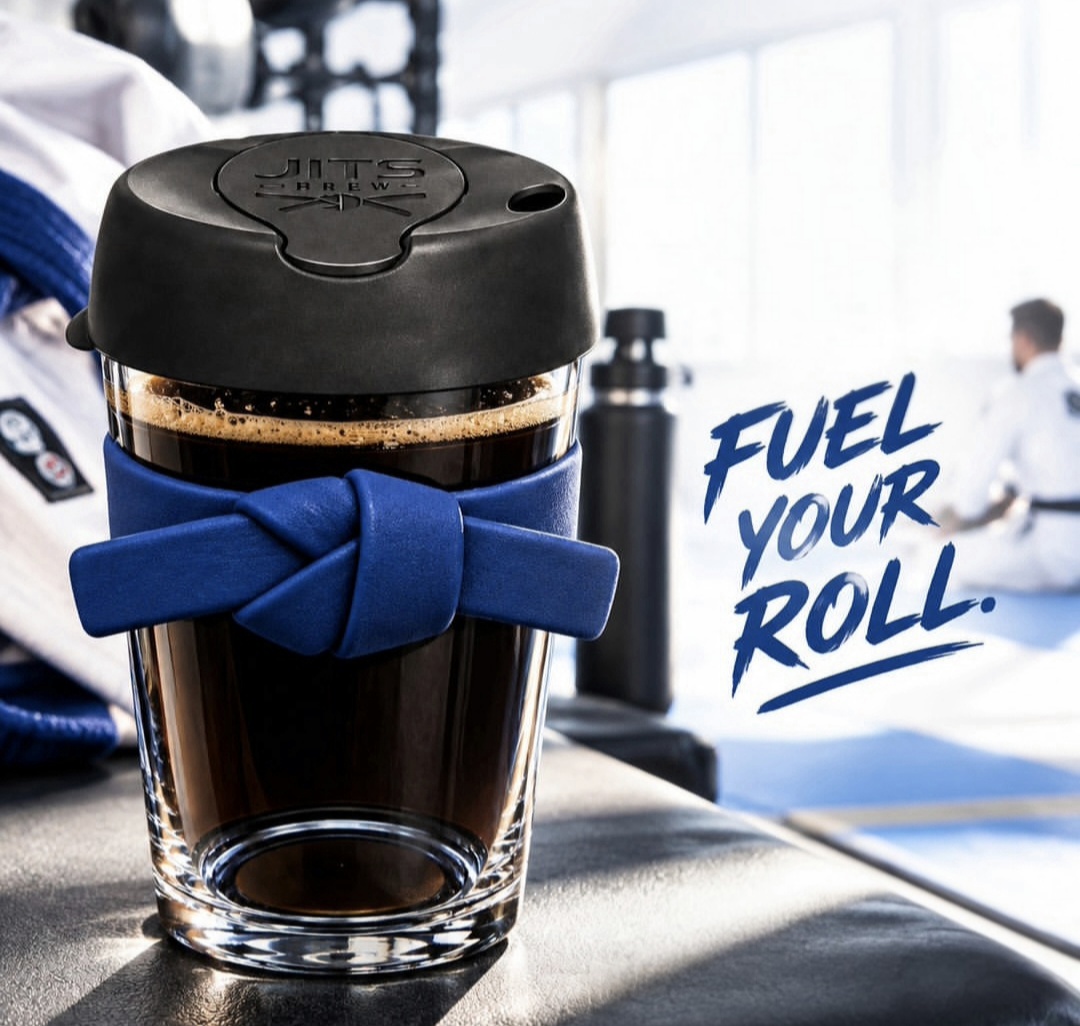 Jits Brew cup with blue belt band in a BJJ gym